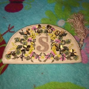 Monogrammed “S” zipper clutch by Anthropologie x Anna Harlow Russo